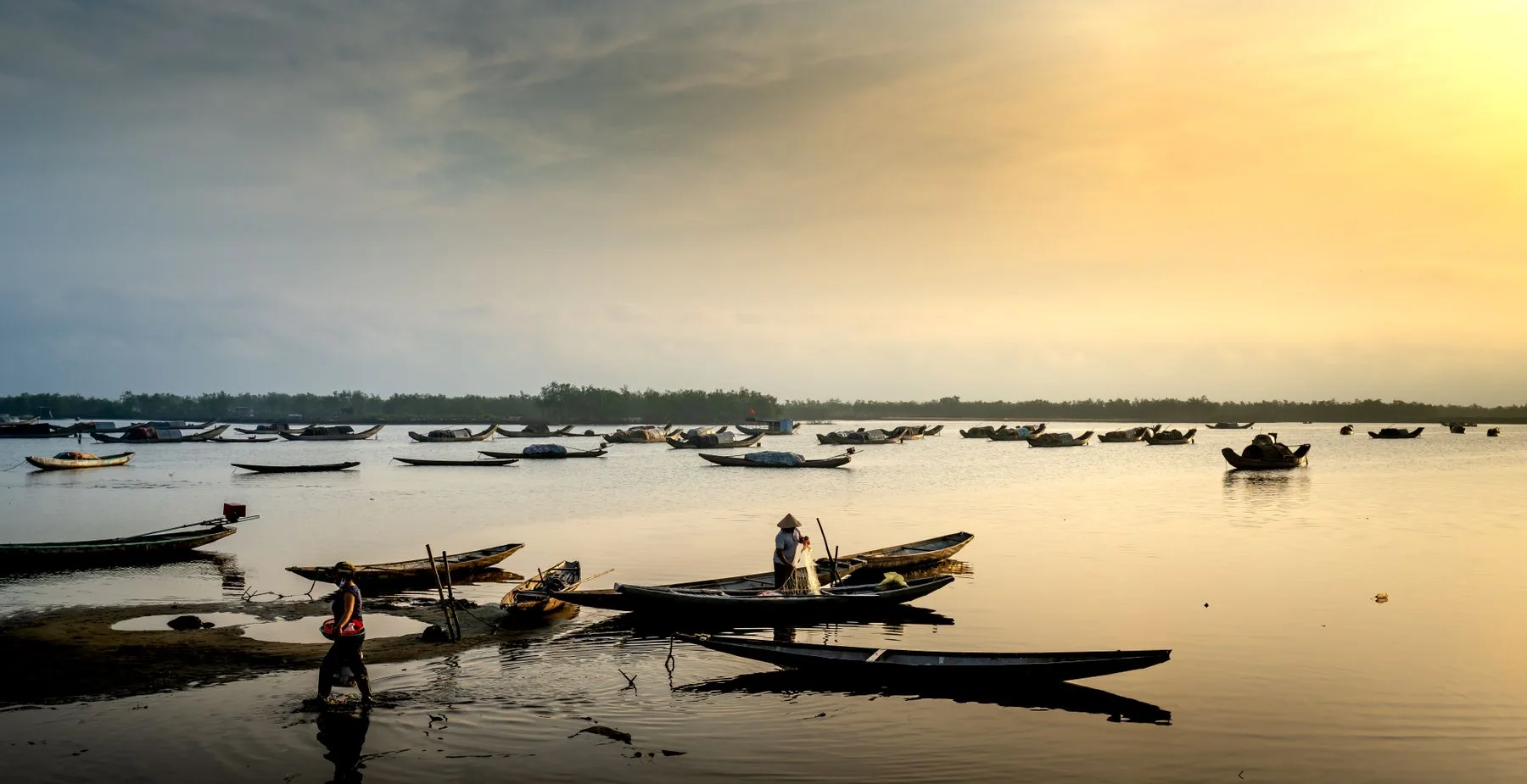 Small boats on a lake at dawn