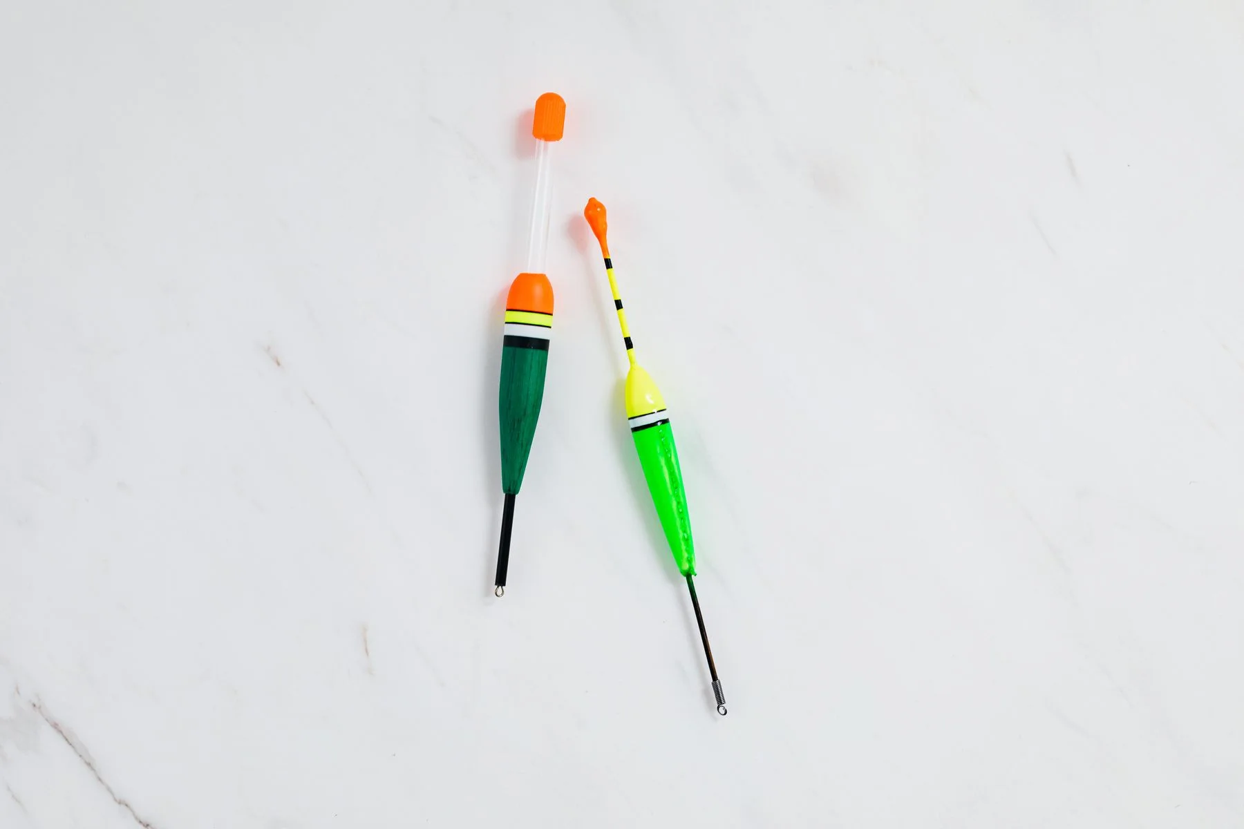 Two colourful fishing floats